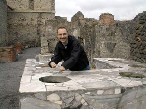 Pompei - Kevin cooking at the corner fast food stop.